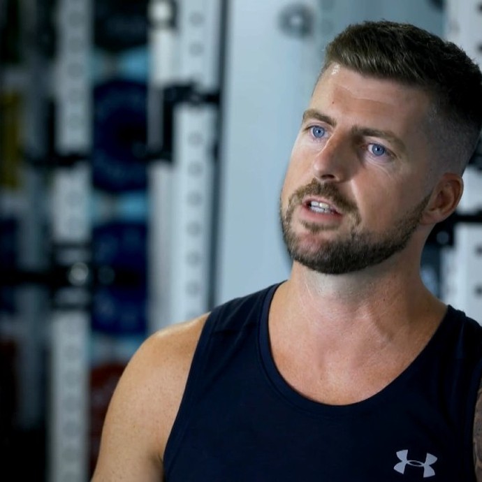 Andrew Williams sat in his wheelchair being interviewed in the gym