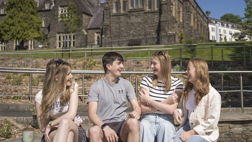 Students sat outside on Carmarthen Campus