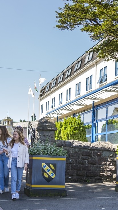 students walking through carmarthen town