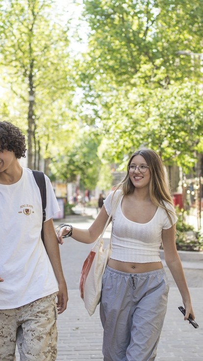 four students walking through swansea town