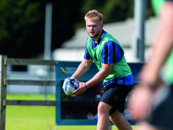 Student throwing a rugby ball