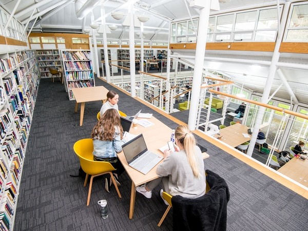 Students sitting in the Carmarthen library