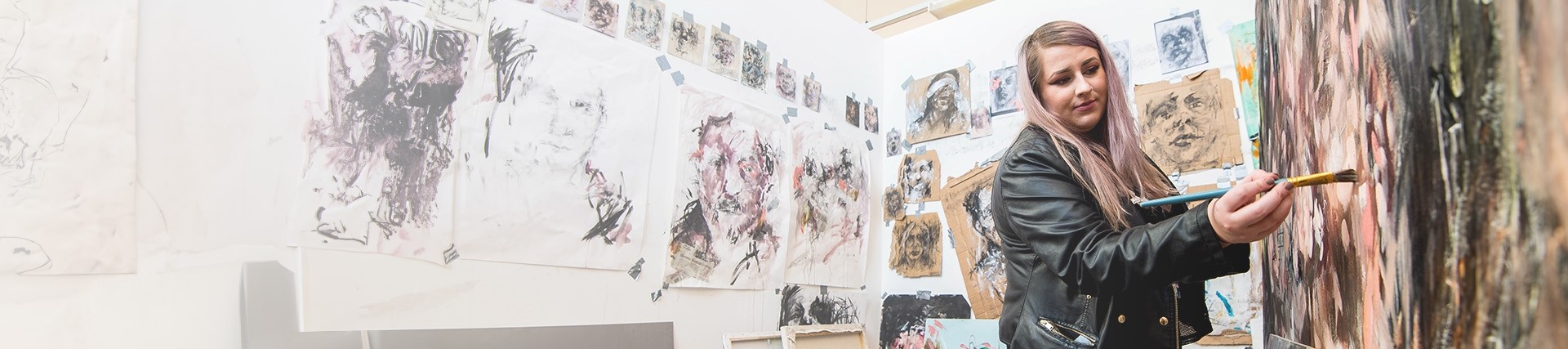Fine Art student painting in a studio