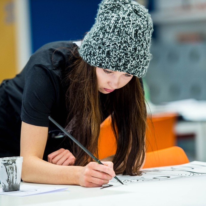 Illustration student drawing in a studio