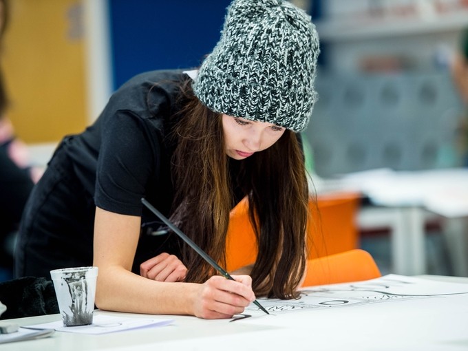 Illustration student drawing in a studio