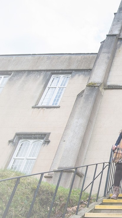 Students walking down the steps outside the Lampeter old building