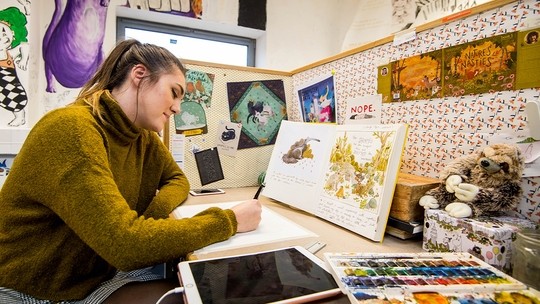 Student working on a project in a studio
