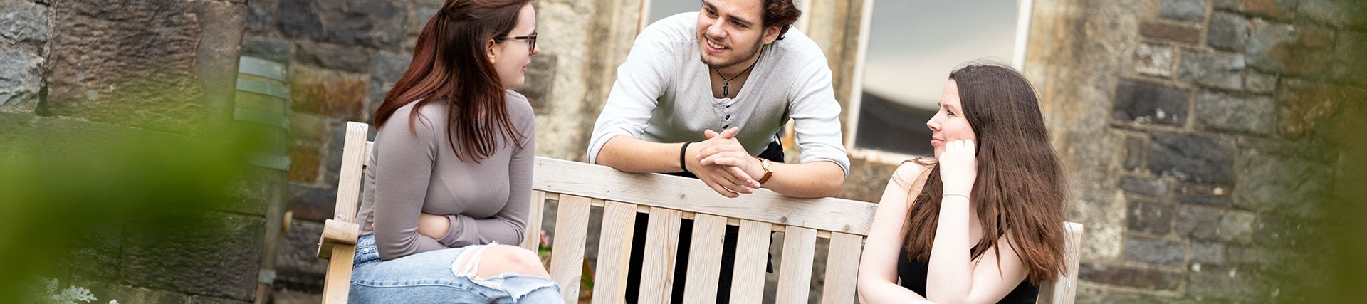 Students Sitting on Bench in Carmarthen