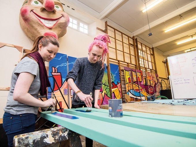 Students painting in the workshop