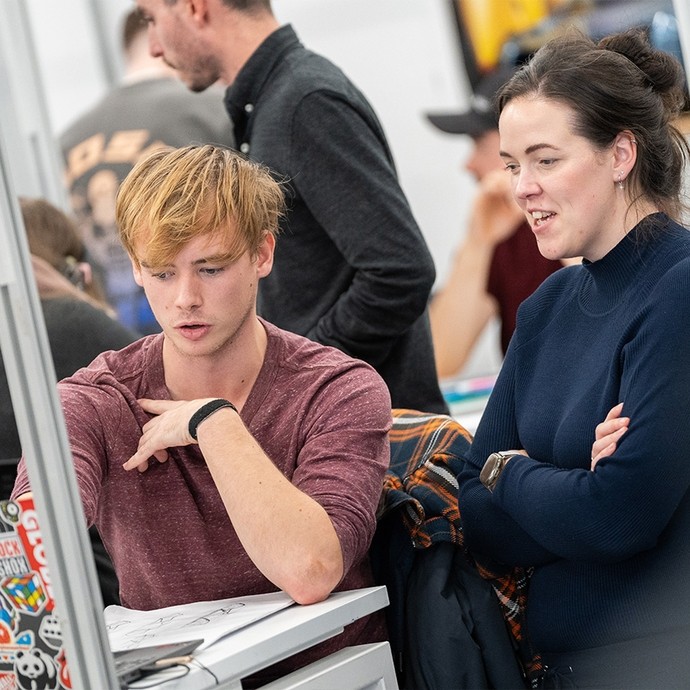 Student in discussion with teacher